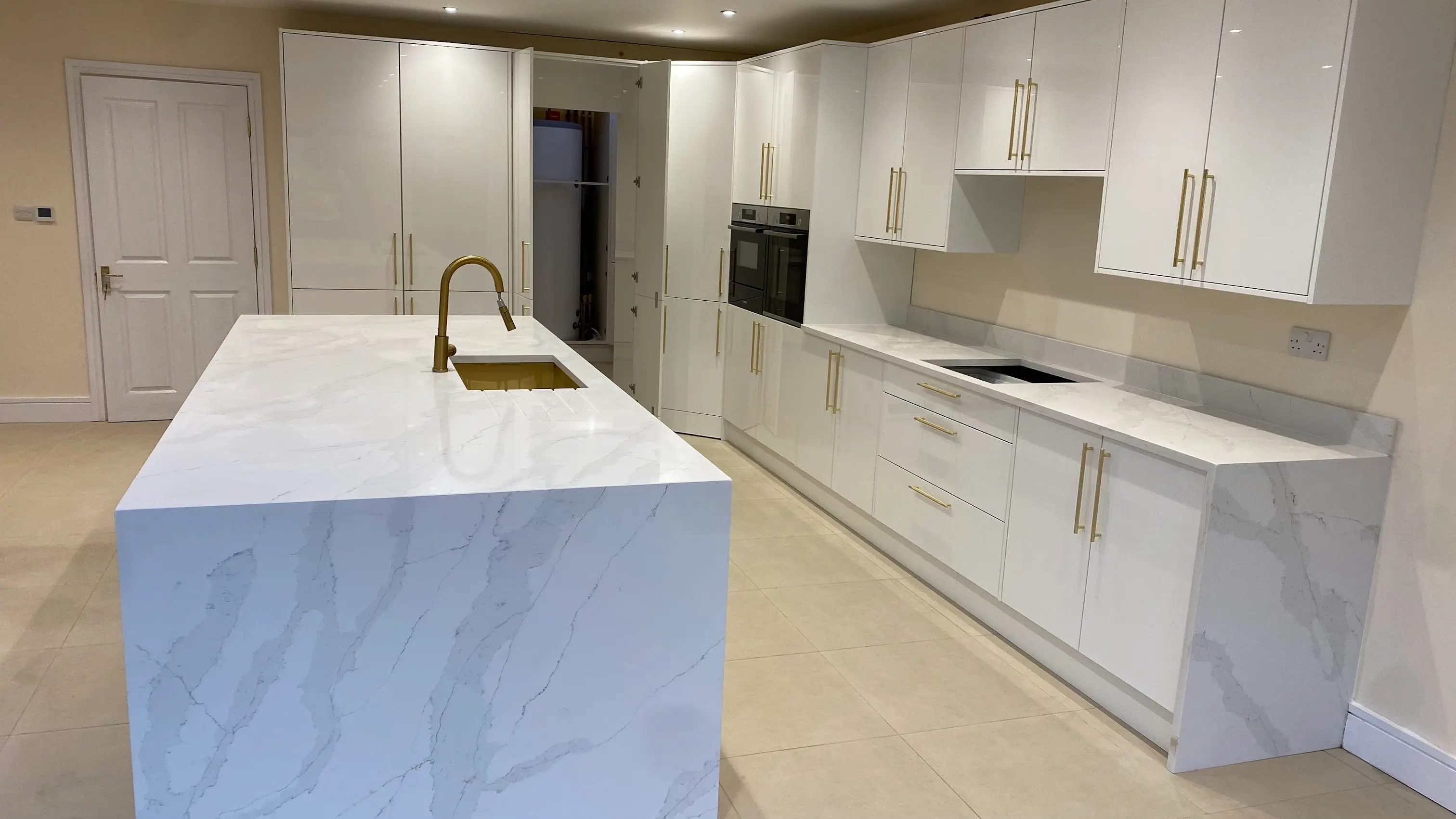 Calacatta Quartz Teddington Calacatta quartz island worktop in a Teddington open-plan kitchen
