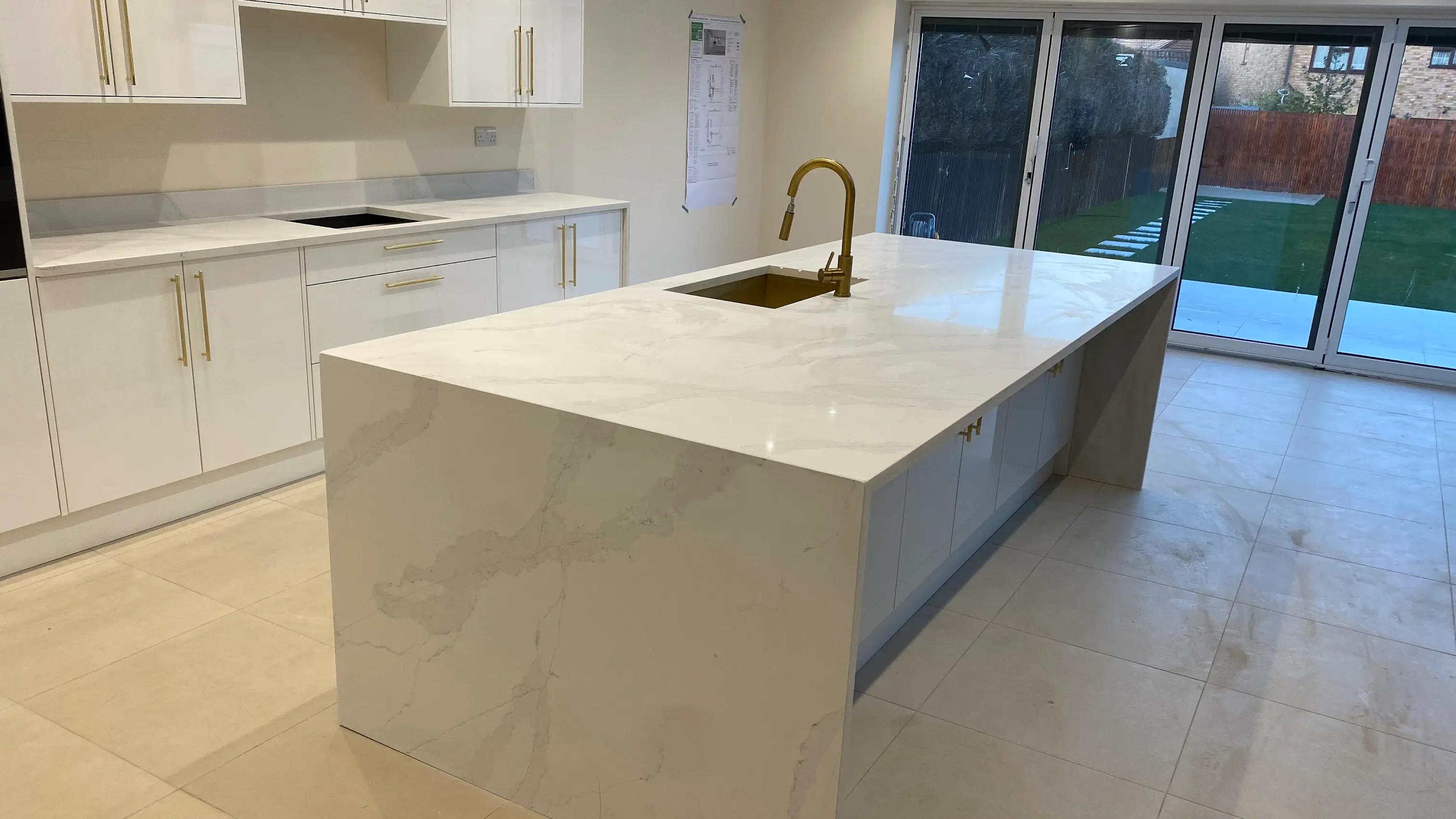 Quartz Worktops Teddington Hero Calacatta quartz worktops supplied and installed in a Teddington kitchen