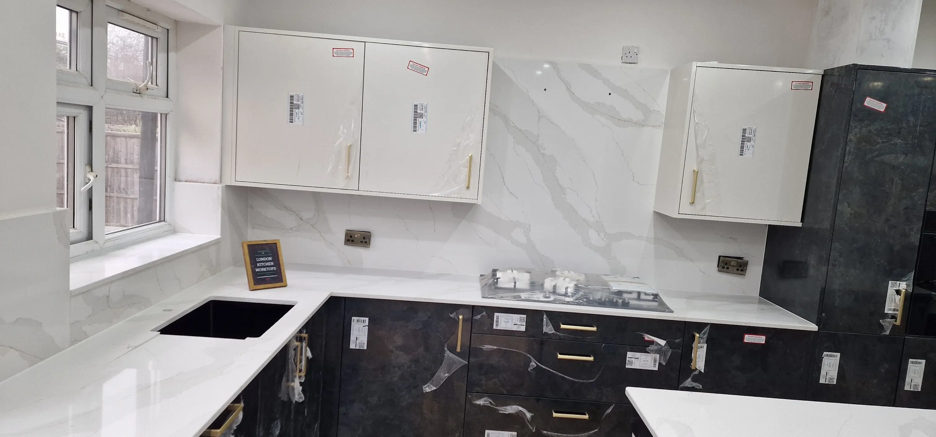 White Quartz Worktops Teddington White quartz worktops fitted in a Victorian or Edwardian Teddington kitchen